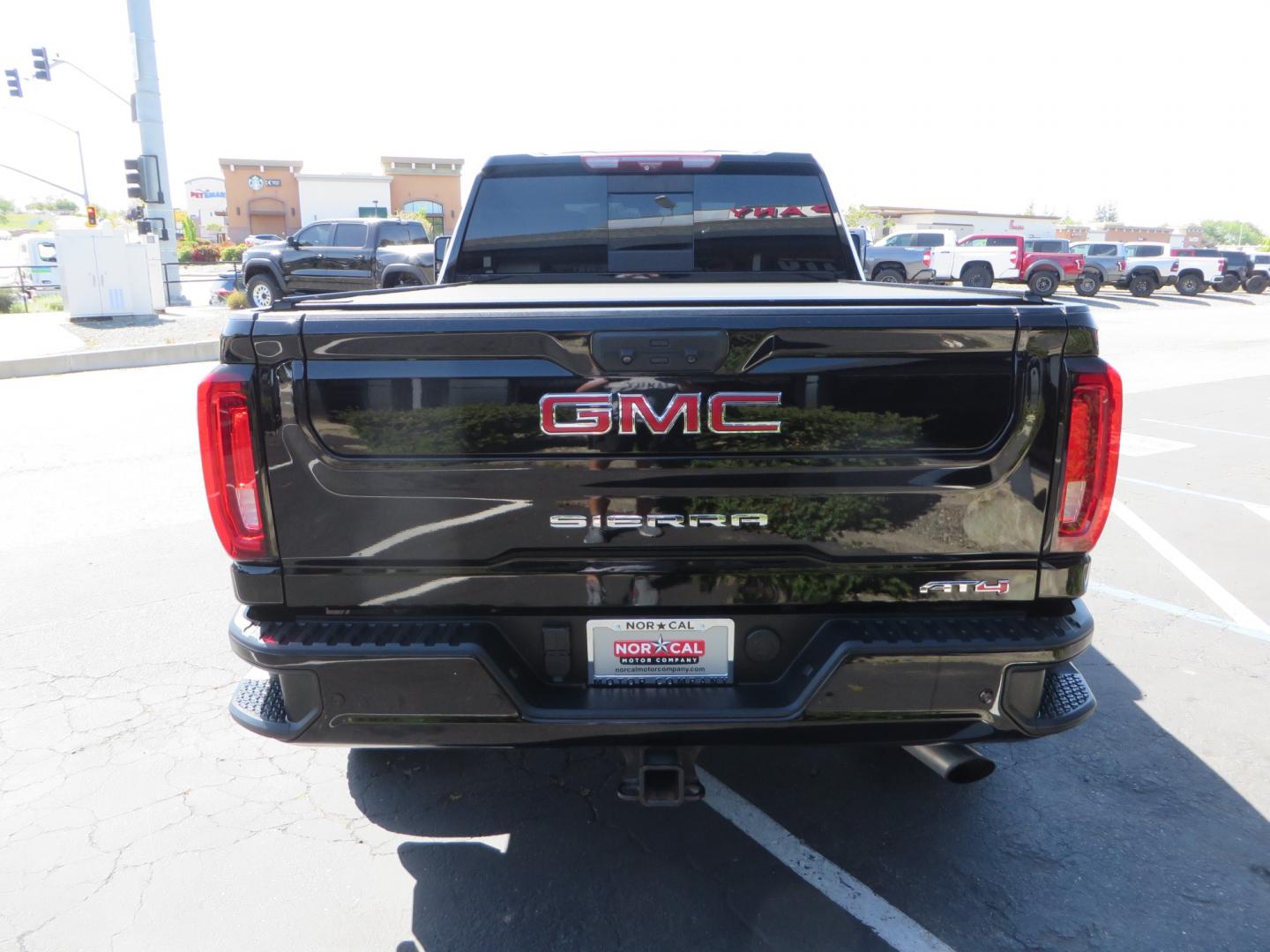 2020 BLACK /BLACK GMC Sierra 2500HD AT4 (1GT49PE76LF) with an 6.6L V8 engine, automatic transmission, located at 2630 Grass Valley Highway, Auburn, CA, 95603, (530) 508-5100, 38.937893, -121.095482 - Features a 3" BDS level kit with Fox shocks, 35" Toyo RT trail tires, 17" Method race wheels, JL audio Subwoofer, Window tint, and a power Tonneau cover. - Photo#5